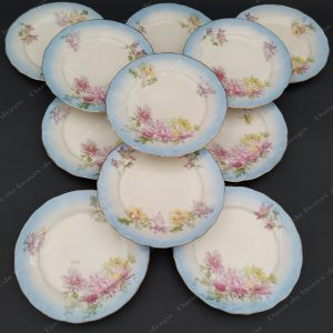 11 assiettes à pain ou à lunch en porcelaine de Limoges.